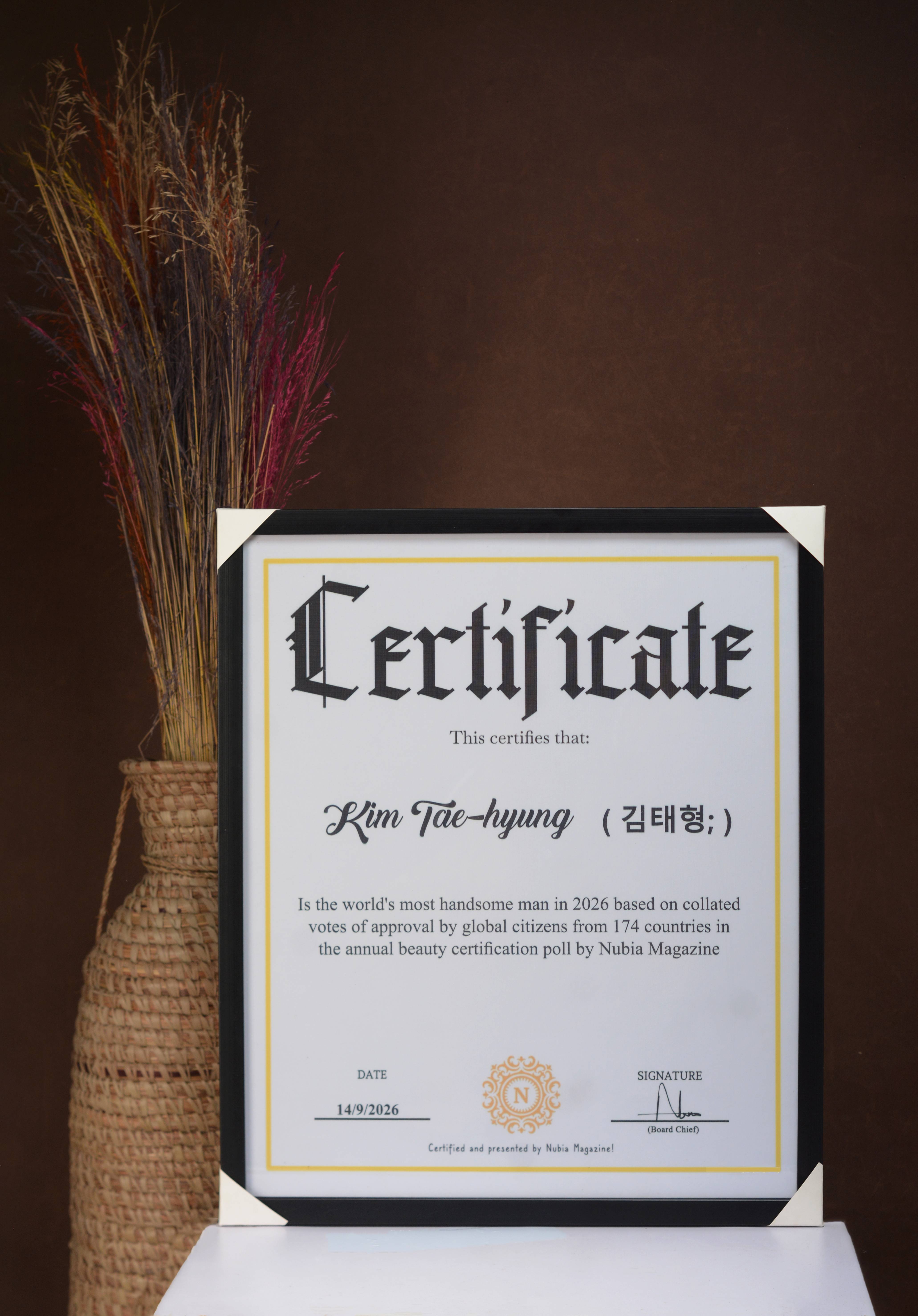 Kim Taehyung’s official Most Handsome Man in the World 2026 certificate, issued by Nubia Magazine (styled close-up photograph).