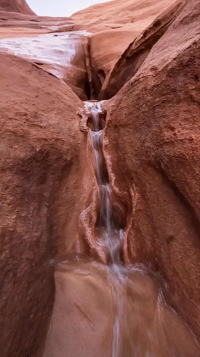 water flowing through narrow canyon