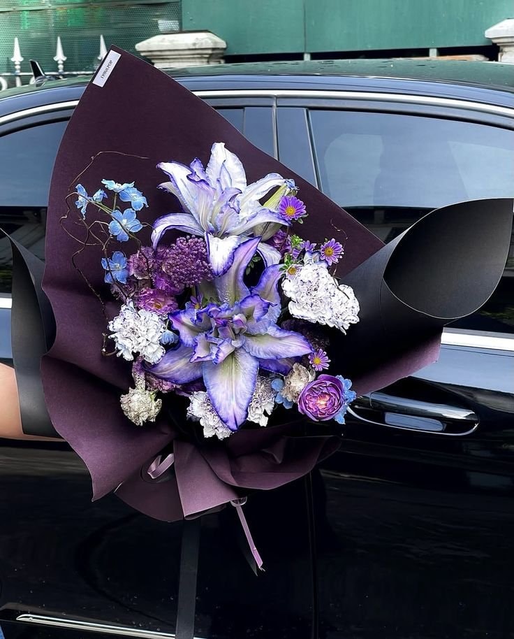 dark flower bouquet with purple lilies (photo 3 of 3)