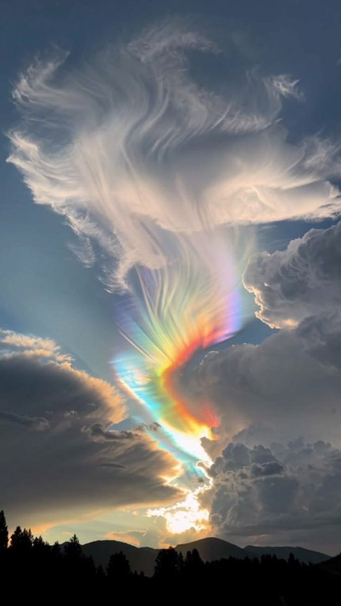 rainbow clouds against blue sky (photo 3 of 4)