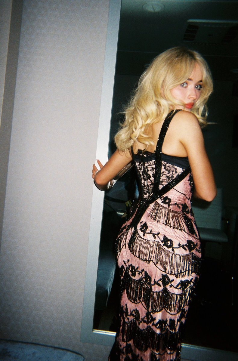 Sabrina Carpenter in pink and black dress (photo 2 of 2)