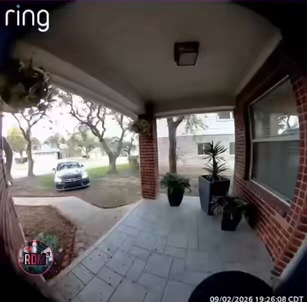 woman drives car into house