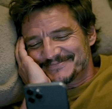 Pedro Pascal checking phone
