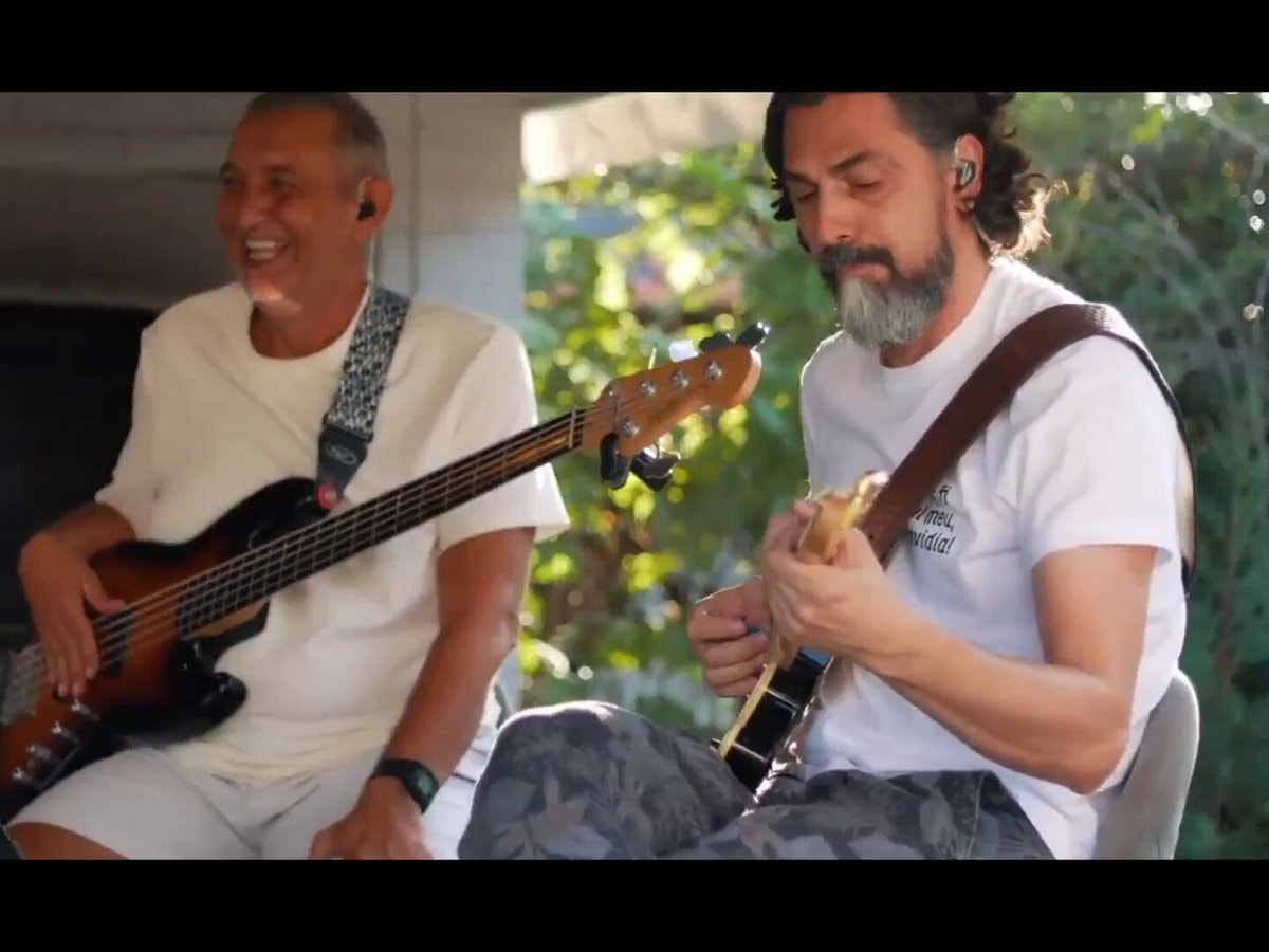 Guitarists jamming outdoors