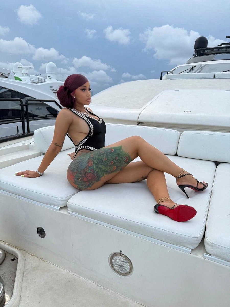 Cardi B yacht black swimsuit tattoo Cardi B yacht black swimsuit tattoo