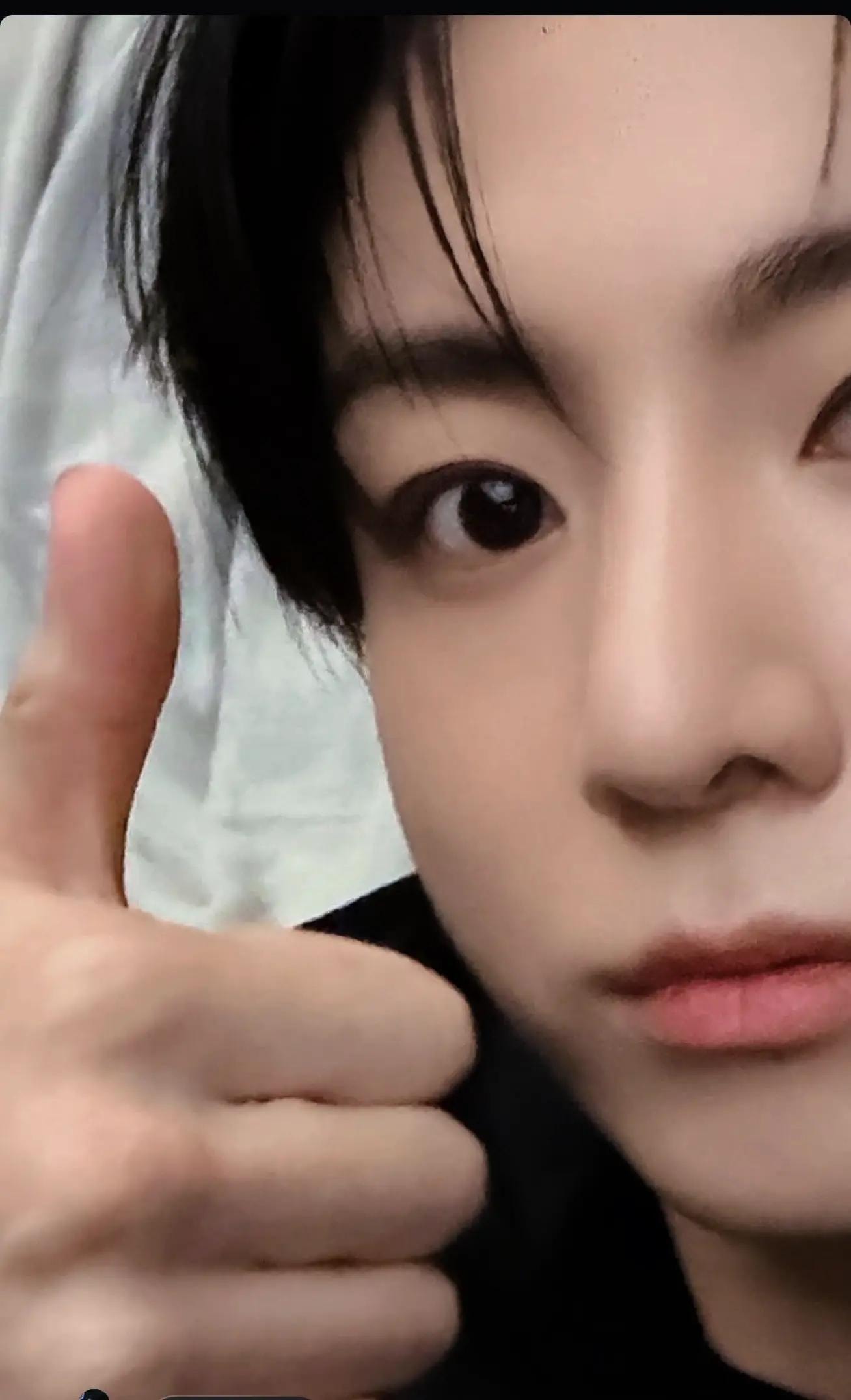 Kook close-up with KING OF THE UNIVERSE necklace (photo 3 of 3)