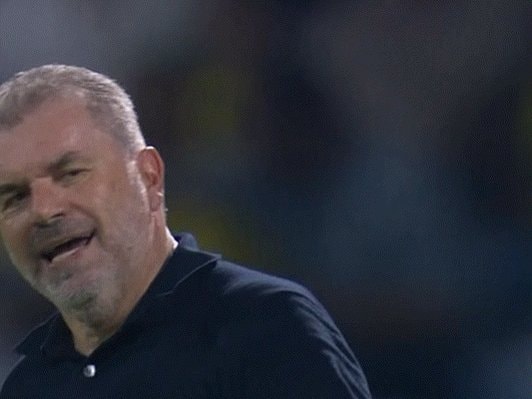 man in blue polo reacting