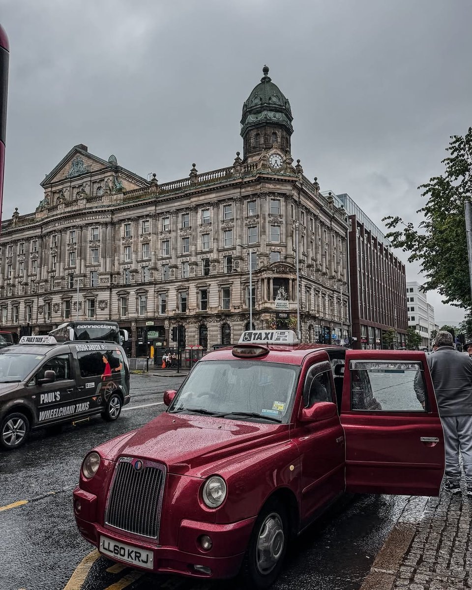 Belfast taxi on wet street