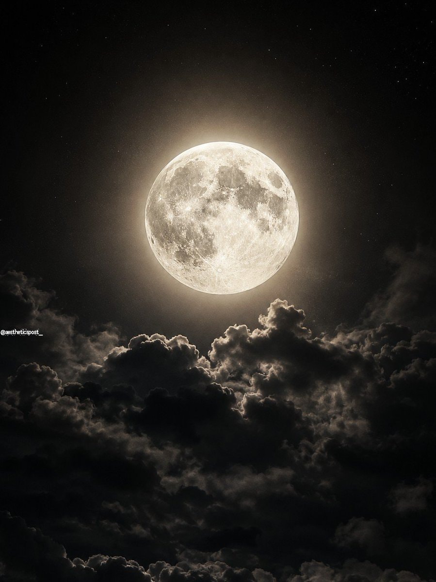 full moon behind clouds