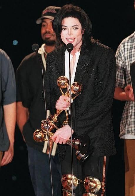 Man Holding Awards (photo 4 of 4)
