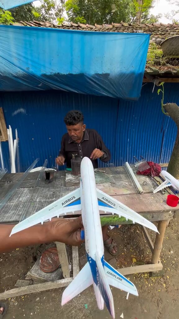 Man building Airbus model plane
