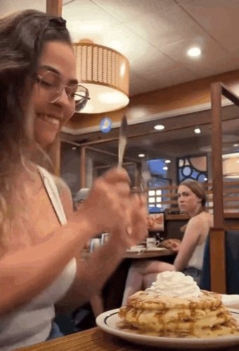 Woman focused on pancakes anticipation