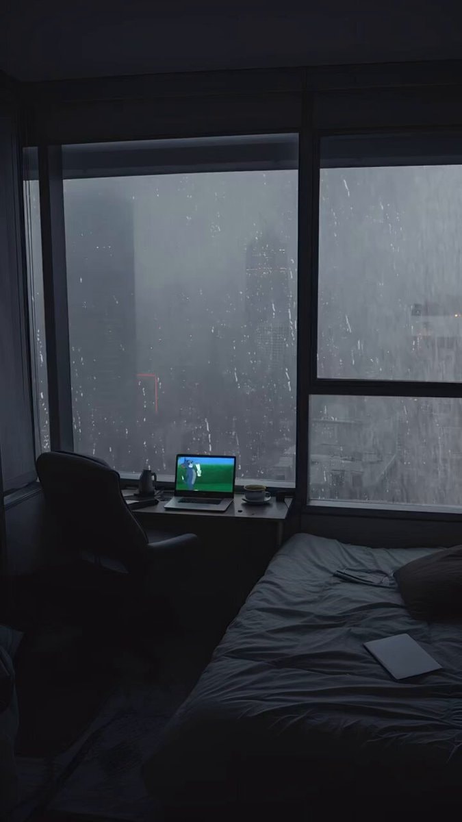 Rainy night city view from window