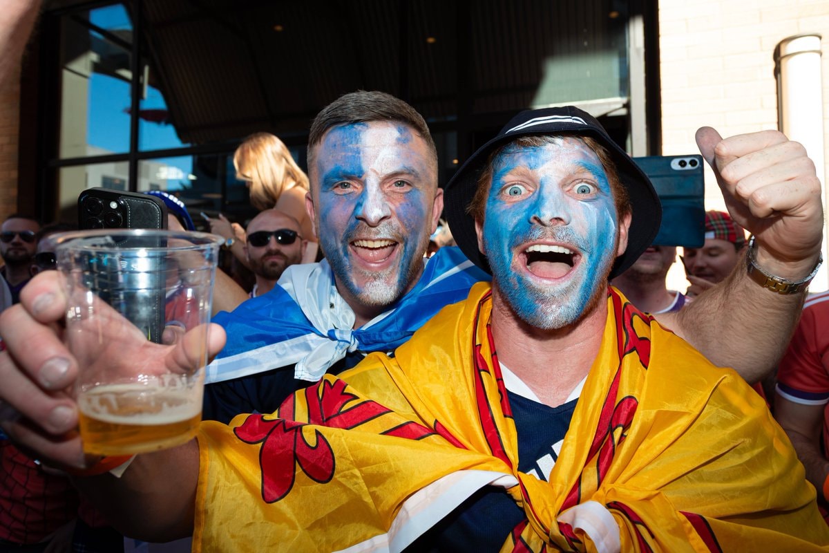 Scottish fan playing bagpipes at match (photo 2 of 2)