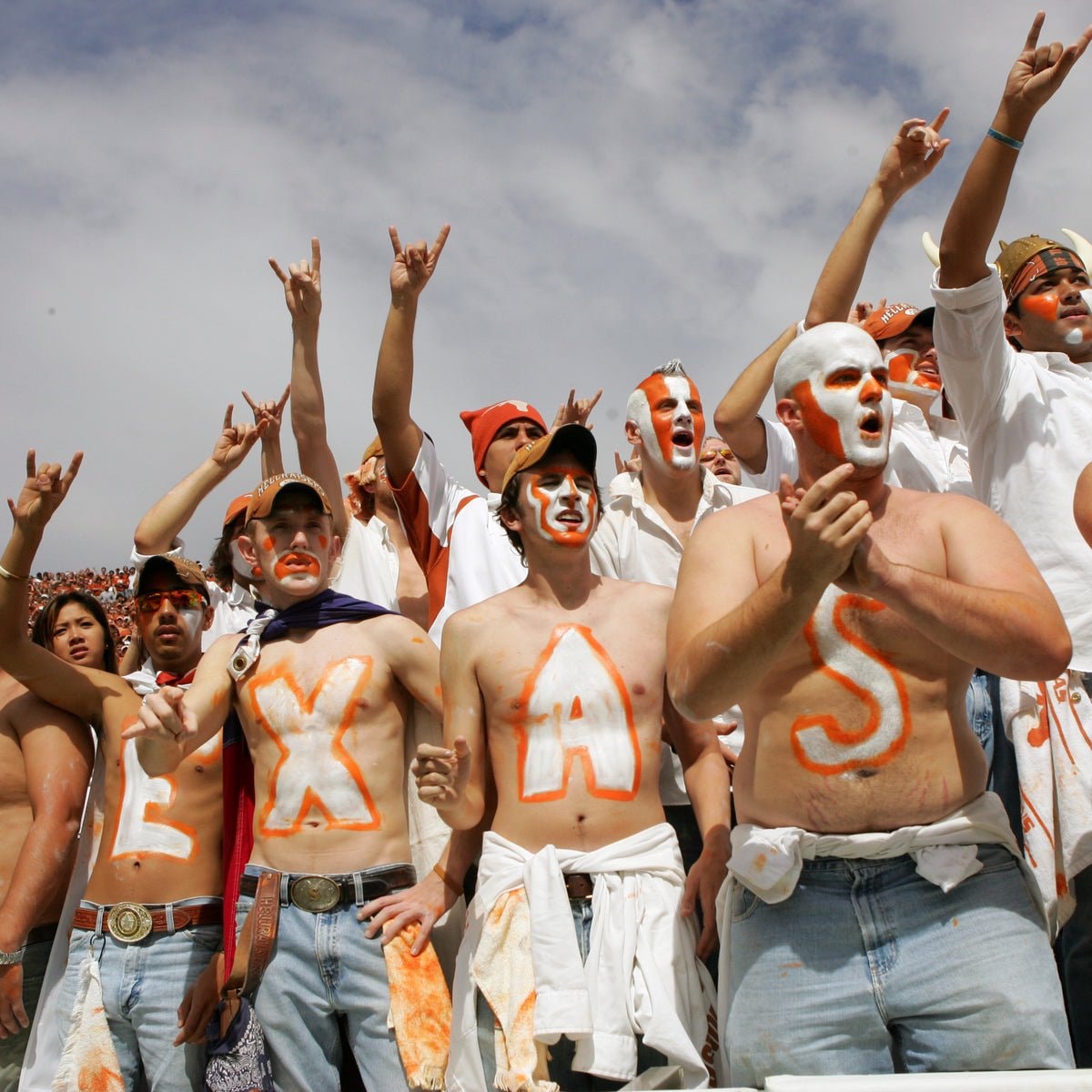 Texas fans with chest paint