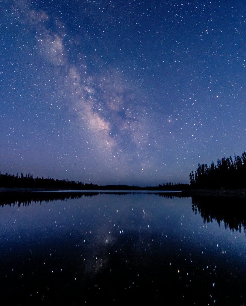 Milky Way over calm lake Milky Way over calm lake