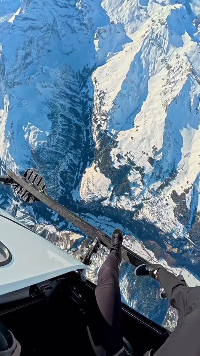 Legs over snowy mountains
