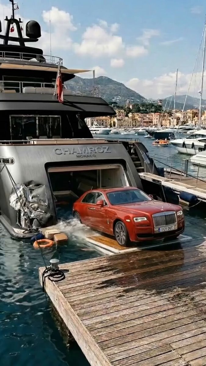 Red Rolls-Royce exits yacht onto dock