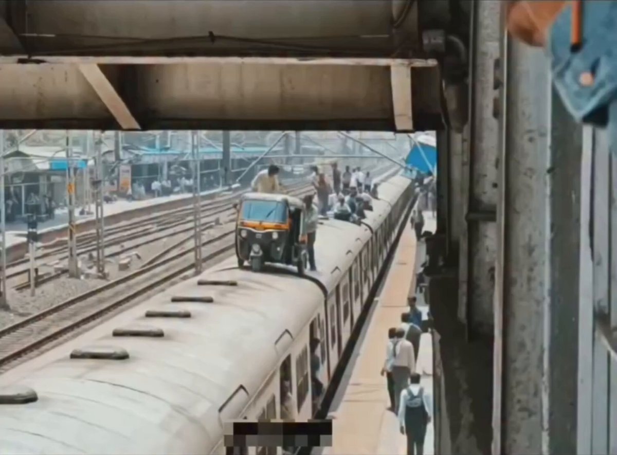 auto-rickshaw on train roof