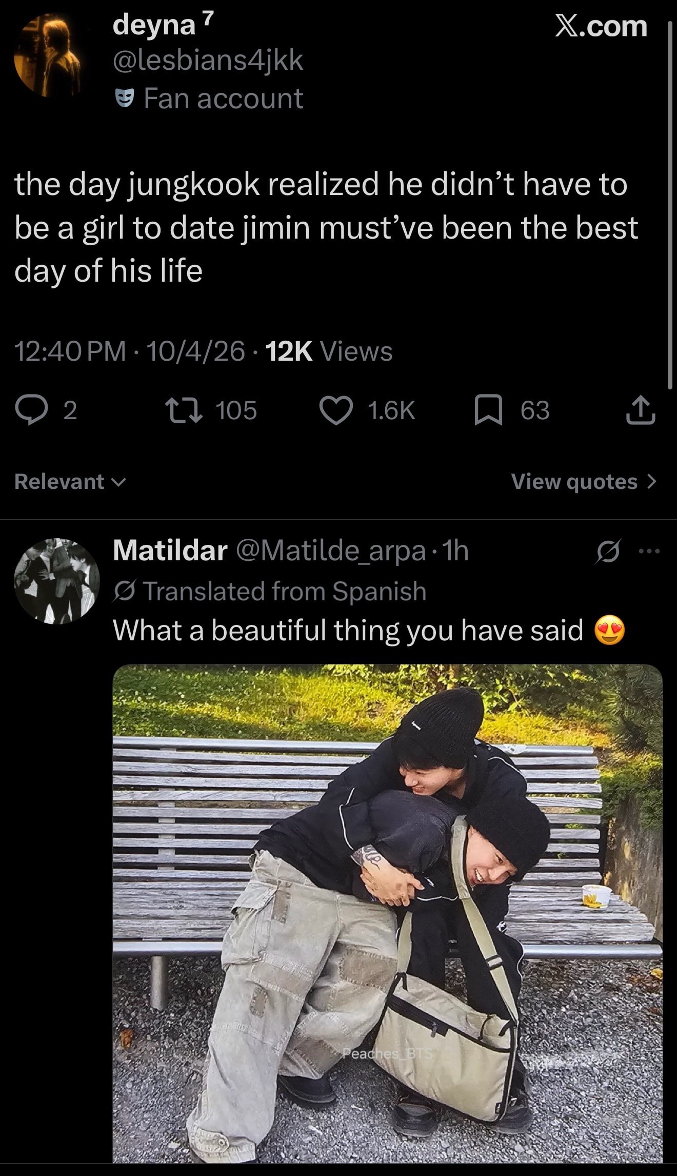 Two people embracing on a park bench
