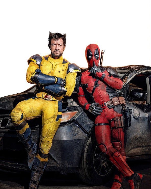 Deadpool and Wolverine pose by car (photo 1 of 2)