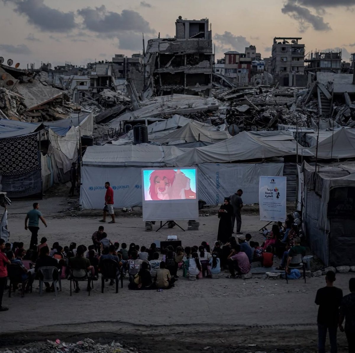 Palestinian children watch The Lion King in Gaza