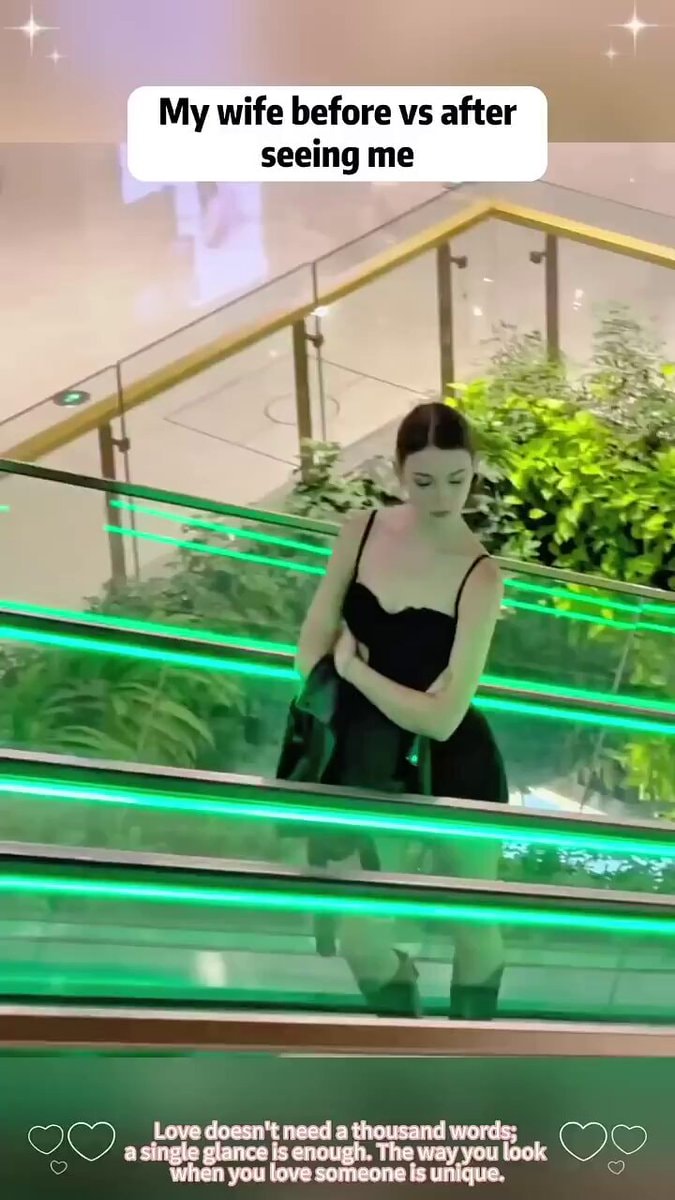 Woman on escalator smiling
