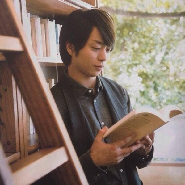 young man reading book