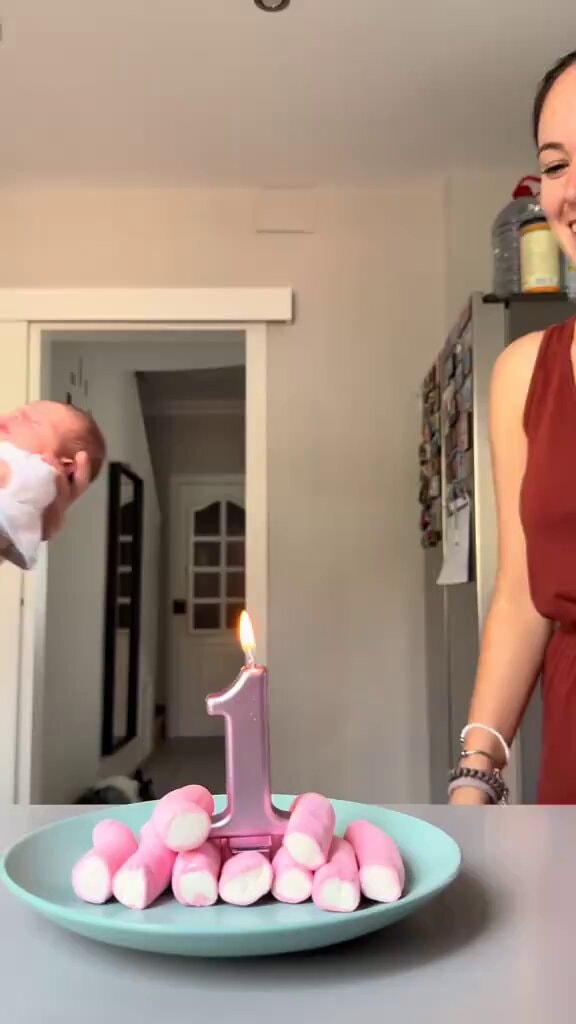 baby with pink marshmallow candle