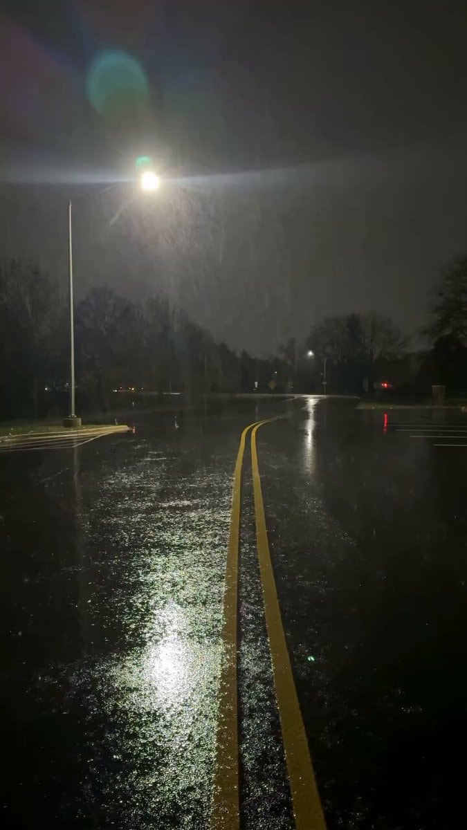 empty wet road at night snow