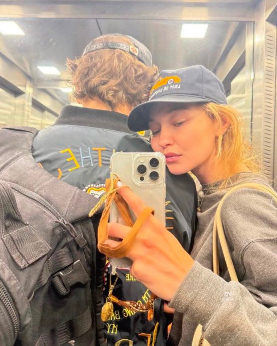 Gigi Hadid Bradley Cooper sunset boardwalk (photo 2 of 2)
