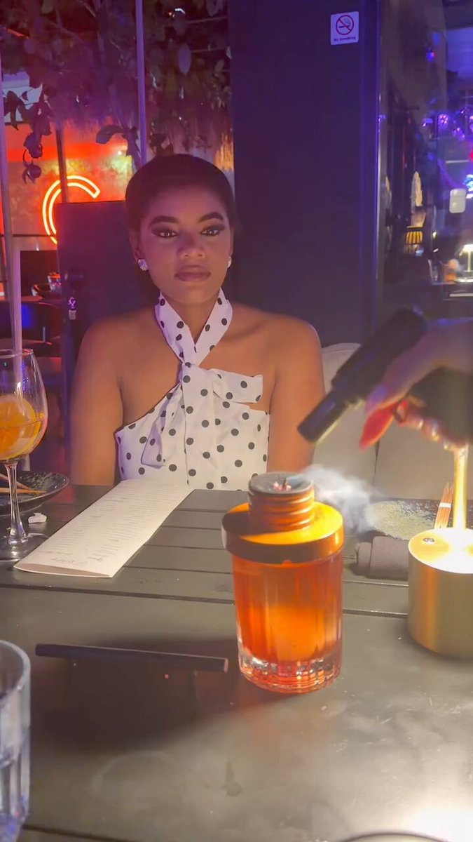 Woman laughs at smoke before the bill arrives Woman laughs at smoke before the bill arrives