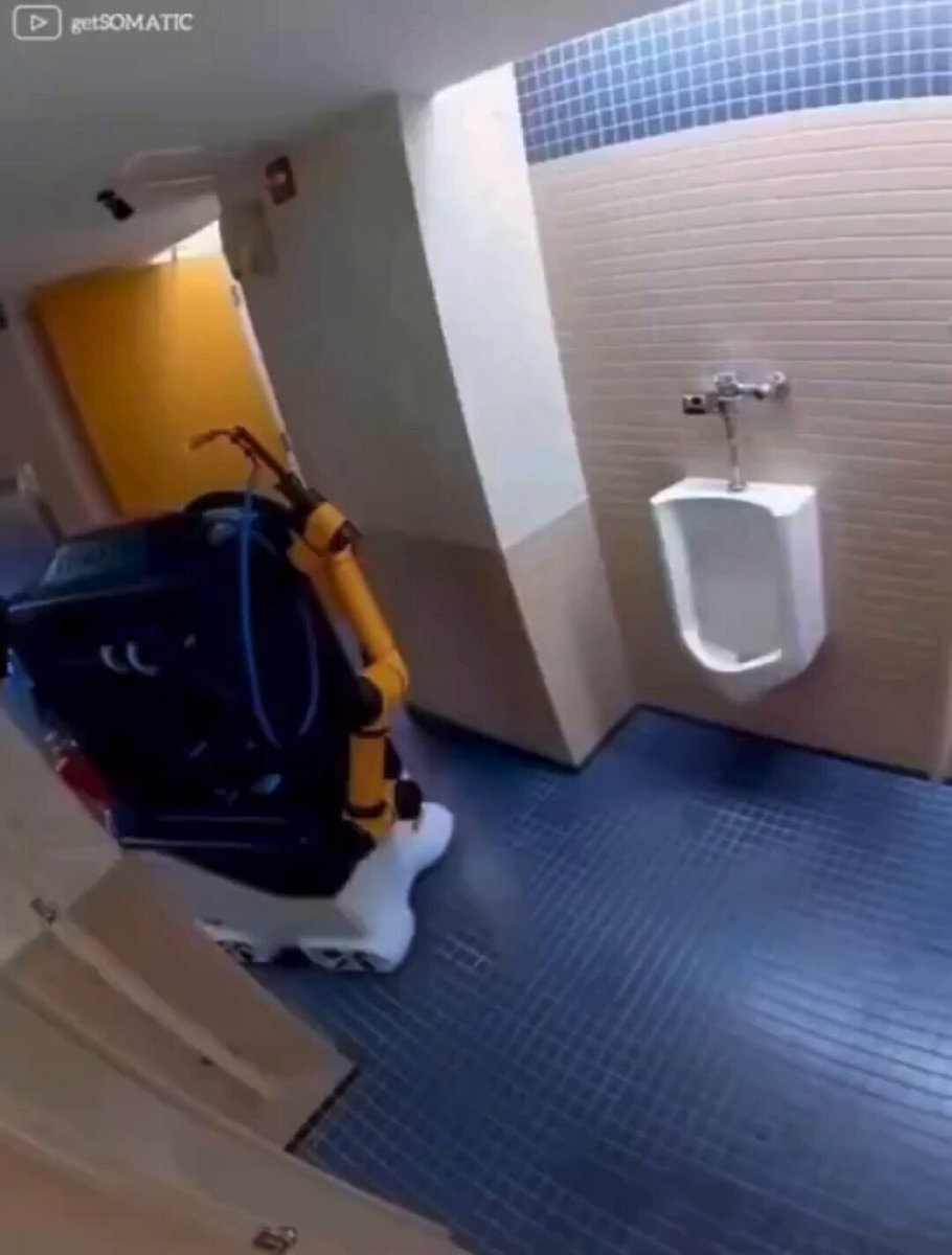 cleaning robot in public restroom