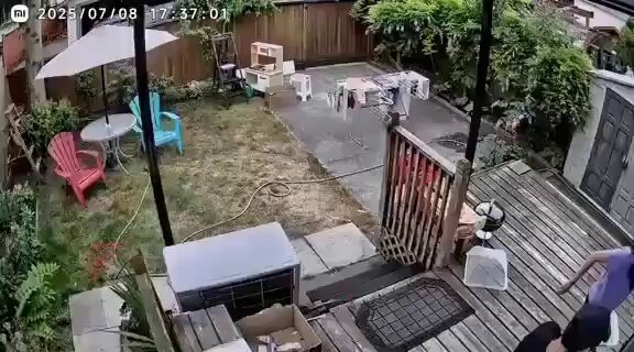 Couple brings clothes inside during rain 😂