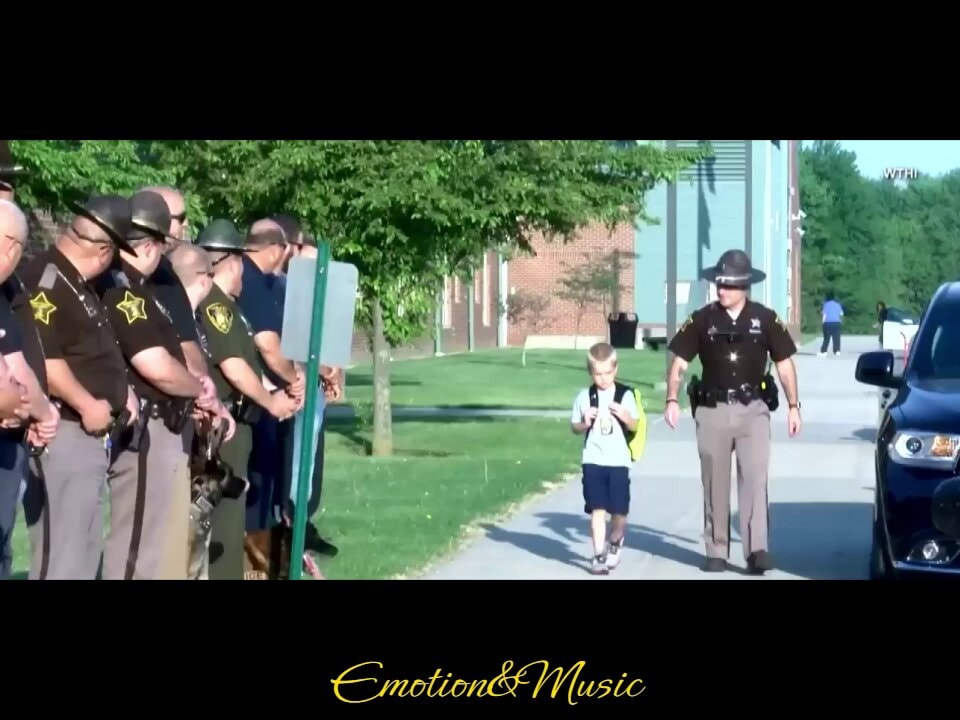 Dakota Pitts walks to school with 70 officers