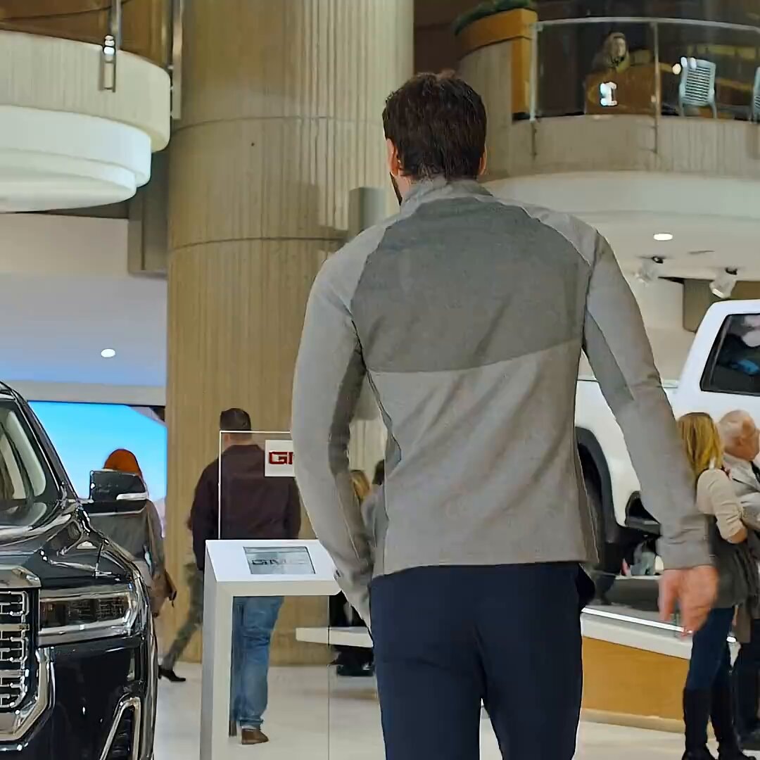 Man walking through GMC dealership
