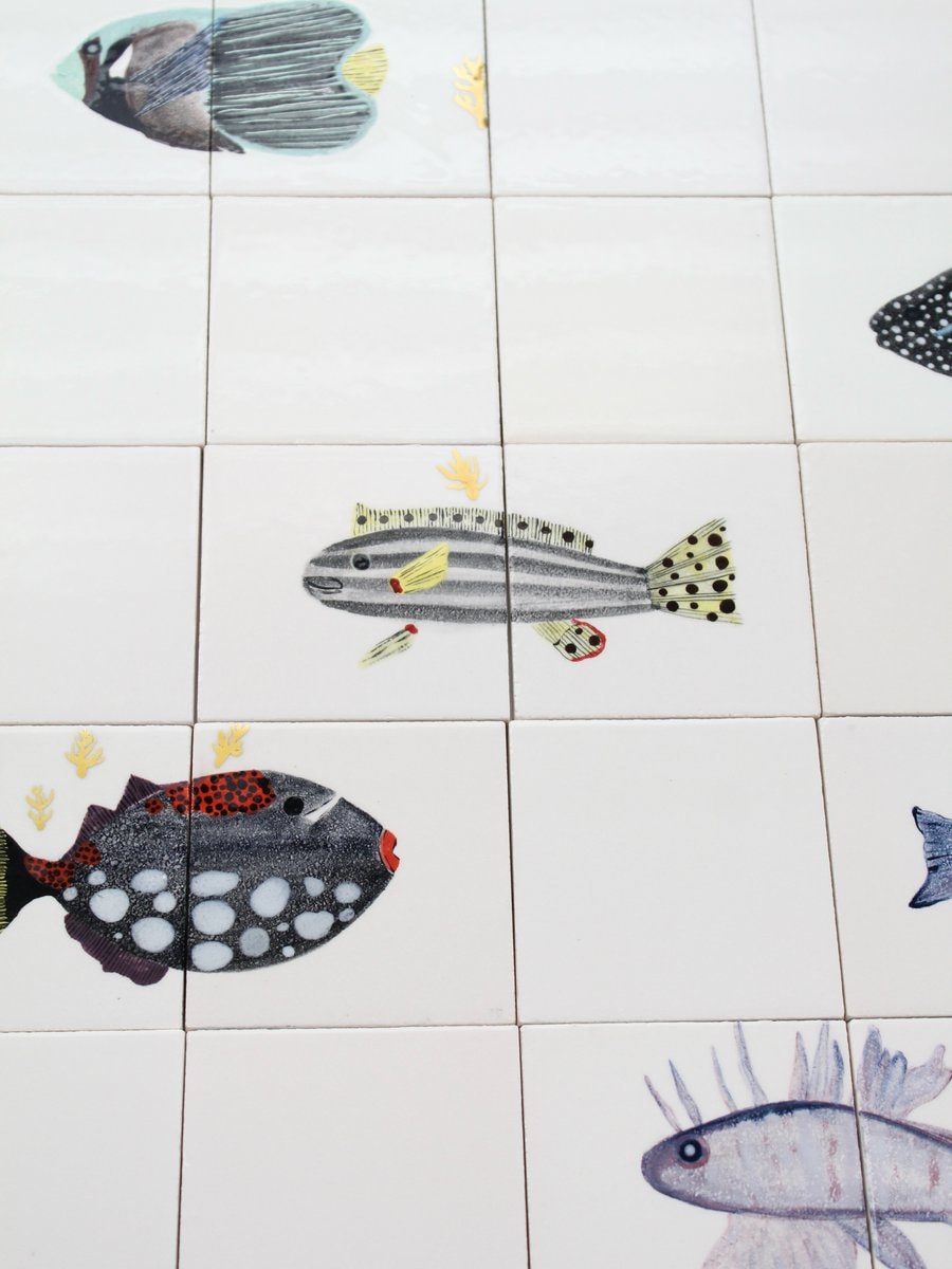 bathroom scene with fish decals (photo 3 of 4)