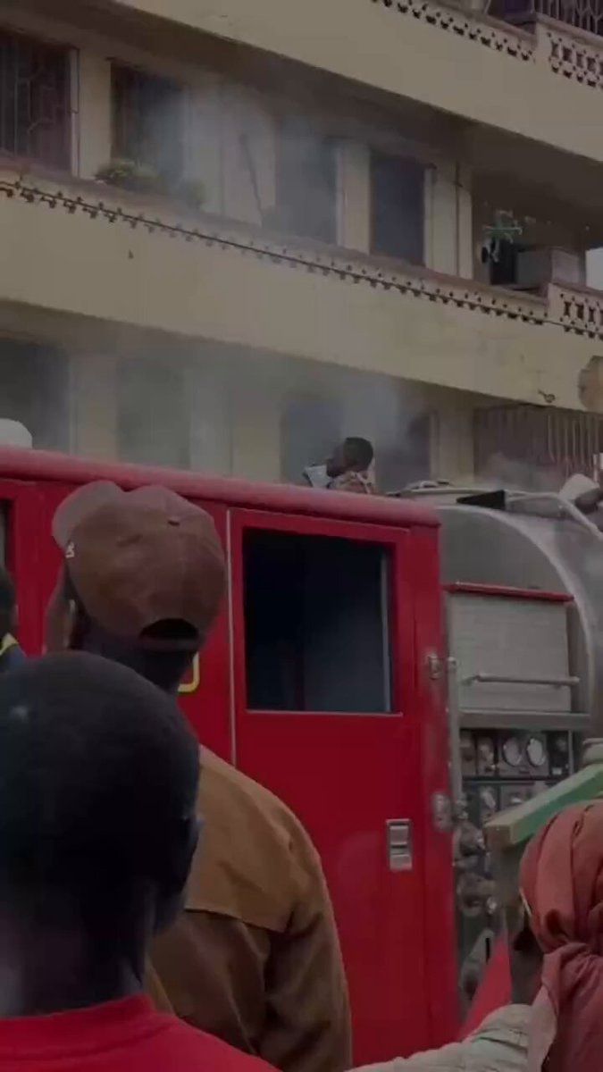 Ghanian firefighters throw water by hand