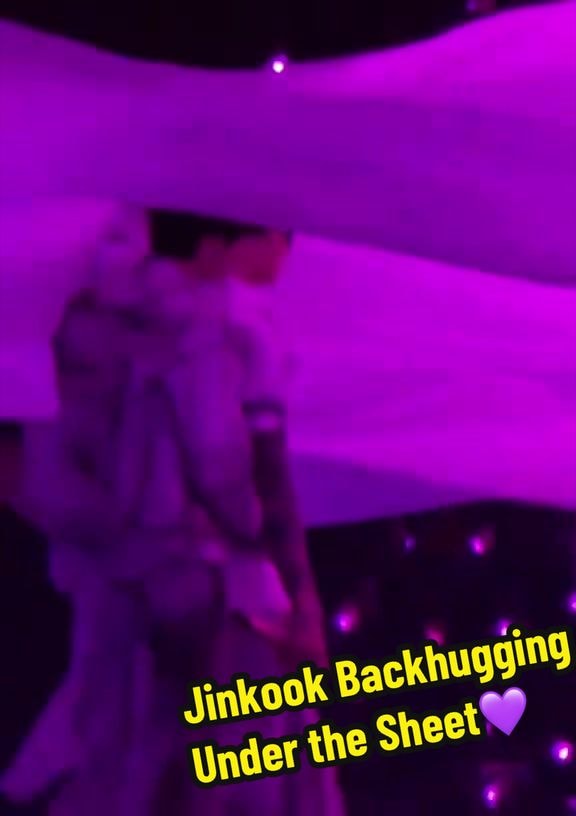 Jin backhugging Jungkook under the sheet