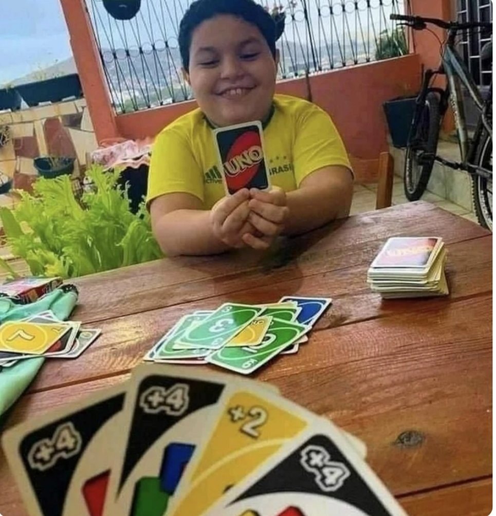 Kid playing Uno Kid playing Uno