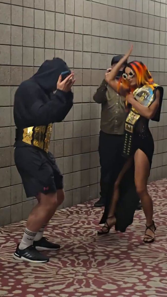 championship belts and orange hair