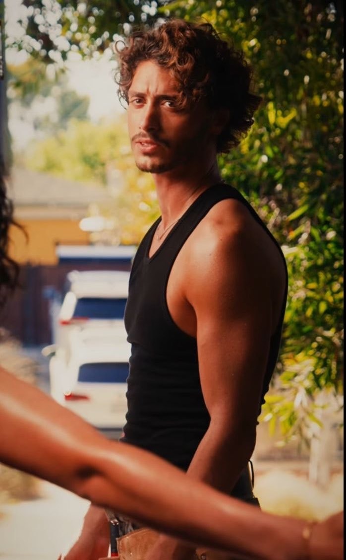 John Logan curly hair mustache