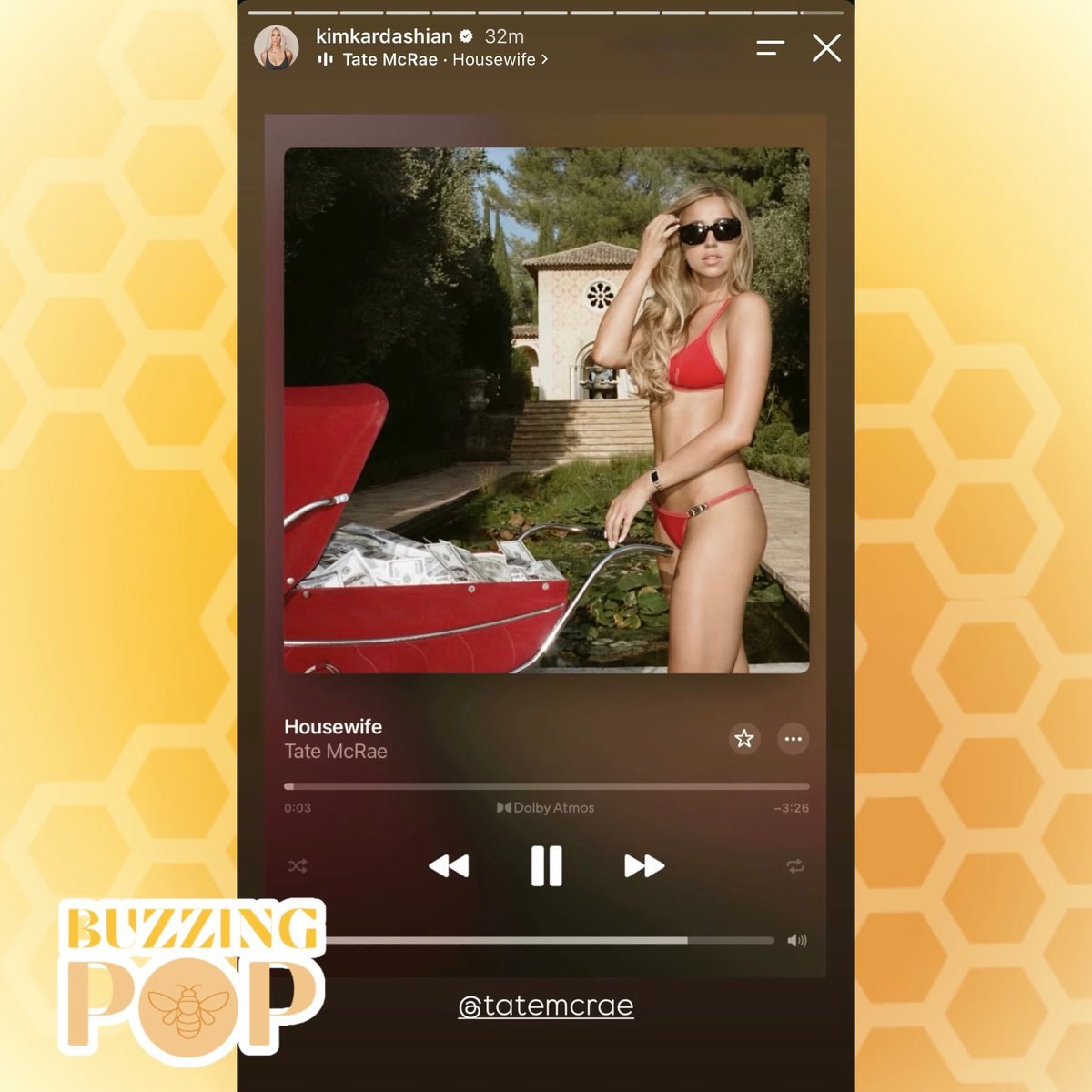 Kim Kardashian listening to Housewife (photo 2 of 2)
