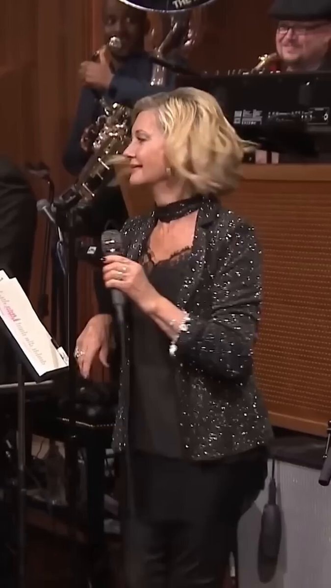 Olivia Newton sparkly blazer performance