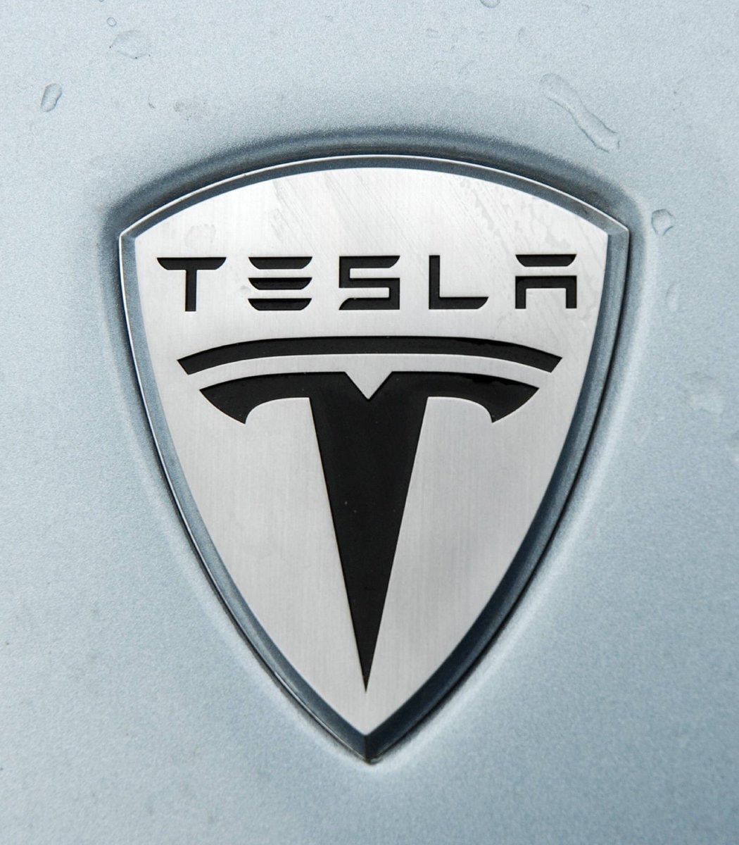 Tesla logo on light blue car
