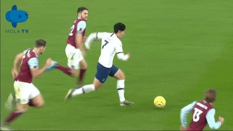 soccer player number 7 dribbling