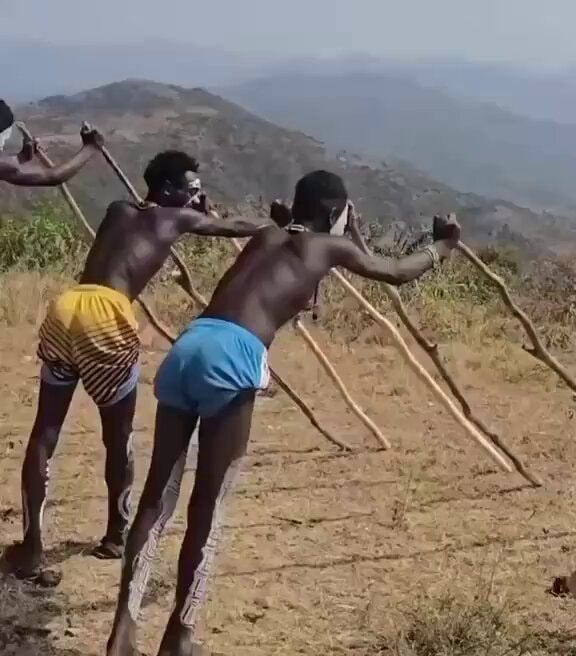 tribe walking on stilts