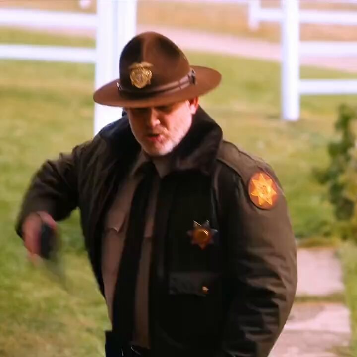 Sheriff walking with badge