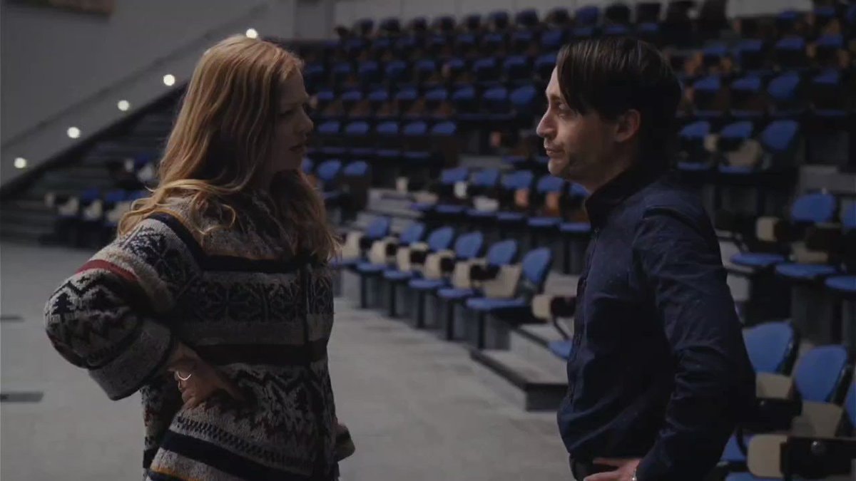 Auditorium scene with aggressive dialogue