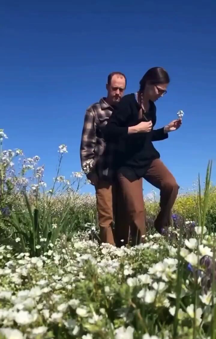 Proposal in white flower field